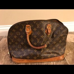 Authentic, damaged Louis Vuitton bag.